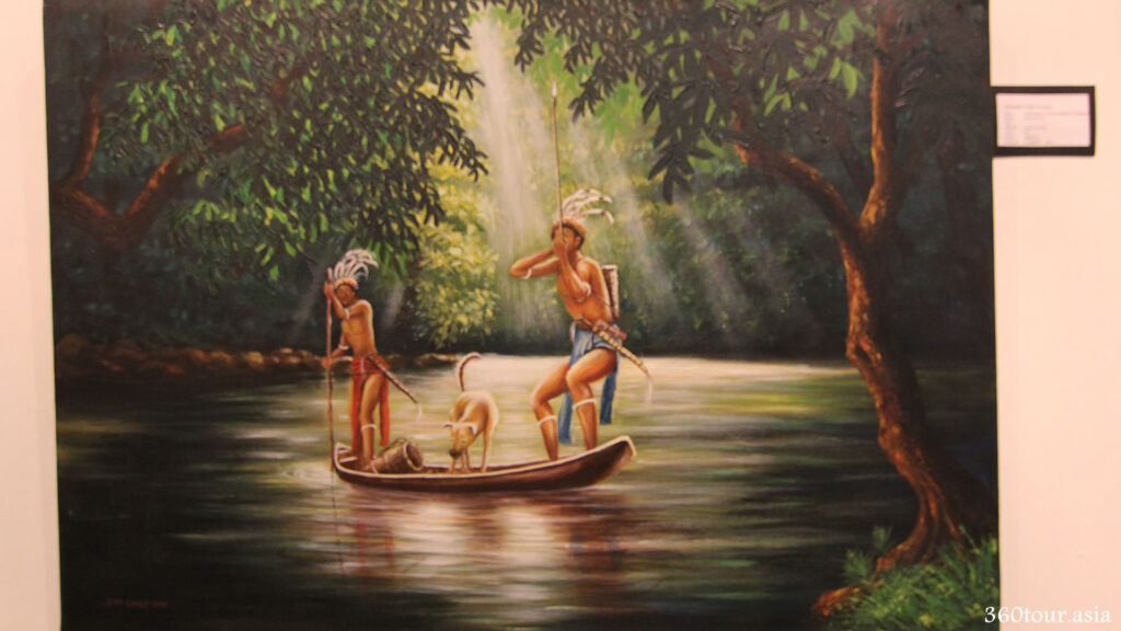 A painting depicts a local dayaks on a boat with one steering the boat and the other holding a blowpipe ready to hunt.