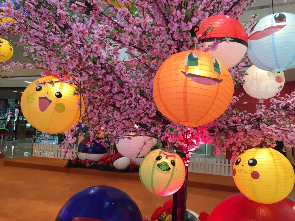 The Pokemon lantern display on the blossoming flower trees 
