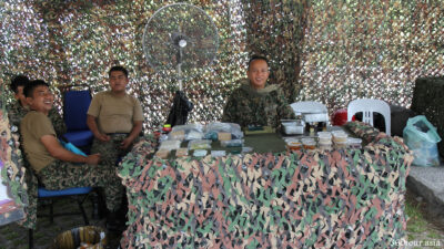 The Army Officials welcome you to try out their portable packed meals.
