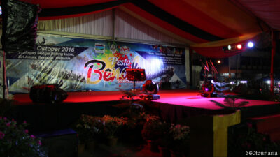 The simple T-shaped stage of Pesta Benak with colorful moving lights.
