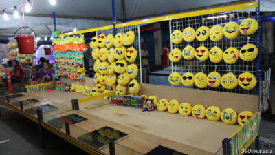The Game Booths with display of emoticon emoji pillows.