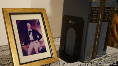 The small photograph of Sir James Brooke, along with a row of classic books