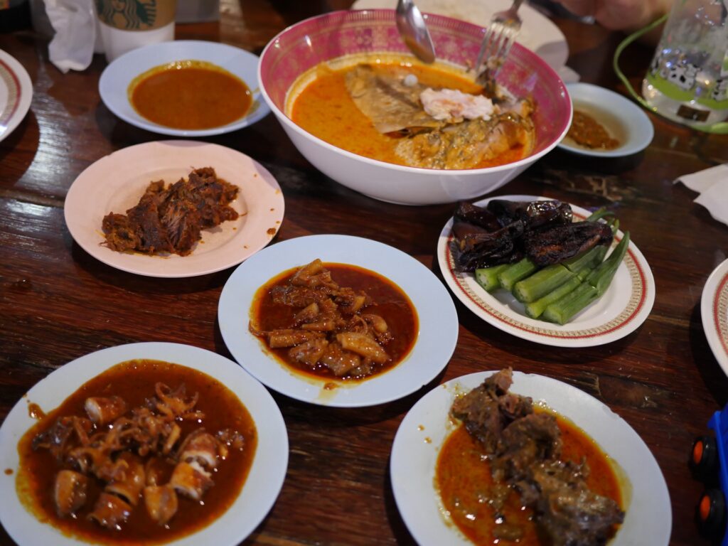 We try out their famous curry fish head, mutton, beef and squid