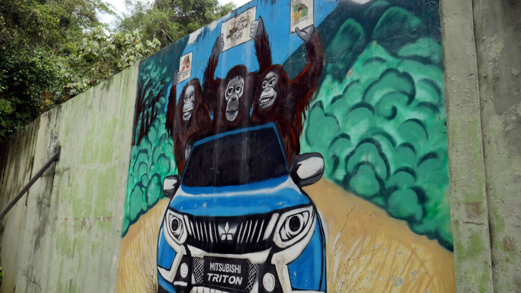 The wall mural of three orangutan on a Mitsubishi Triton