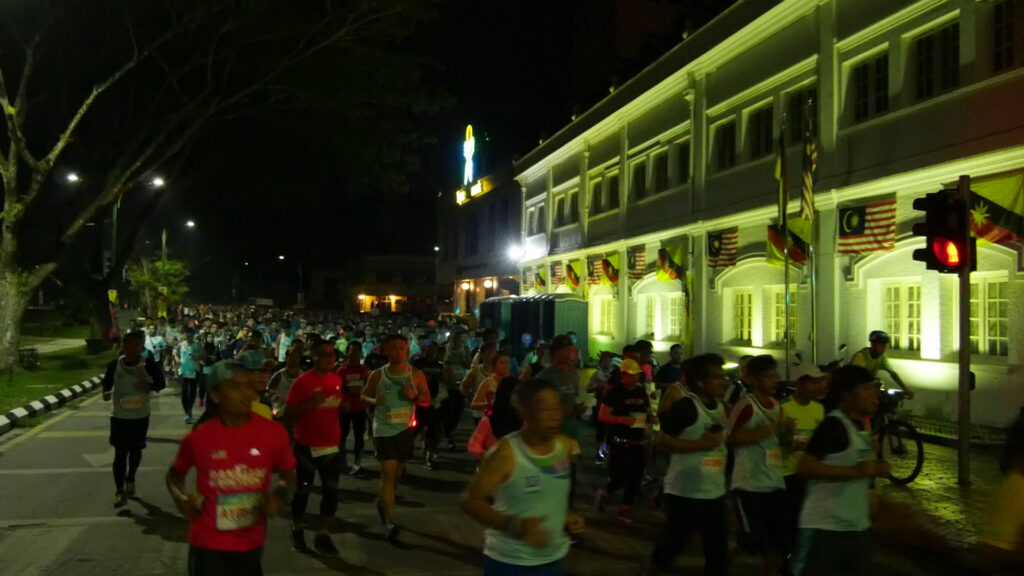 Thousands of runners navigate their route in the Kuching City roads