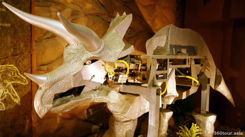 an exposed dinosaur animatronics reveal the details in its motors that responsible for the dinosaur movements
