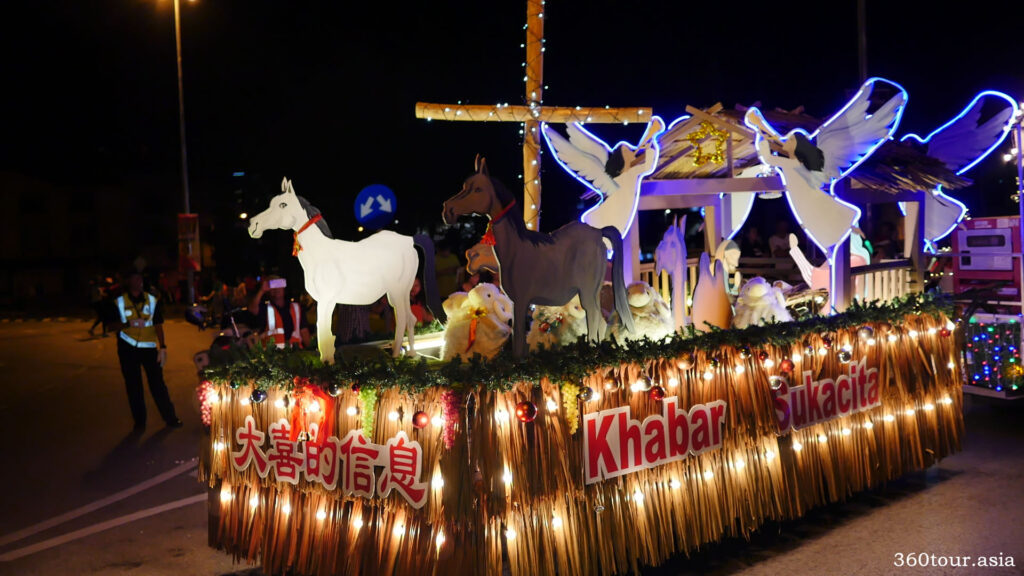 The Christmas float featuring animals around the stable