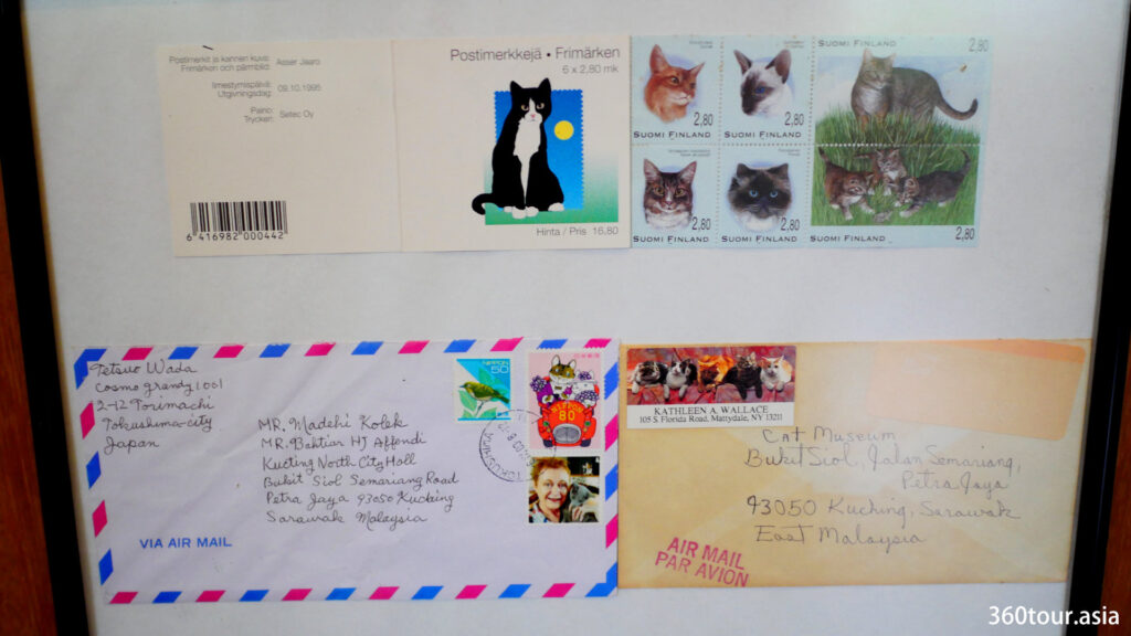 以猫邮票为特色的信封。