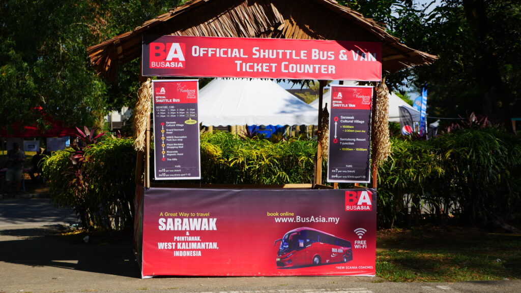 The official shuttle bus and van ticket counter in front of the Sarawak Cultural Village.
