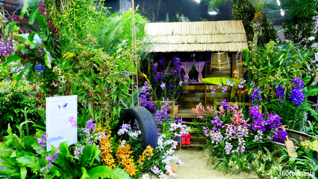 The Orchid Landscape by Orchid Society of South East Asia from Singapore, featuring a villlage house.