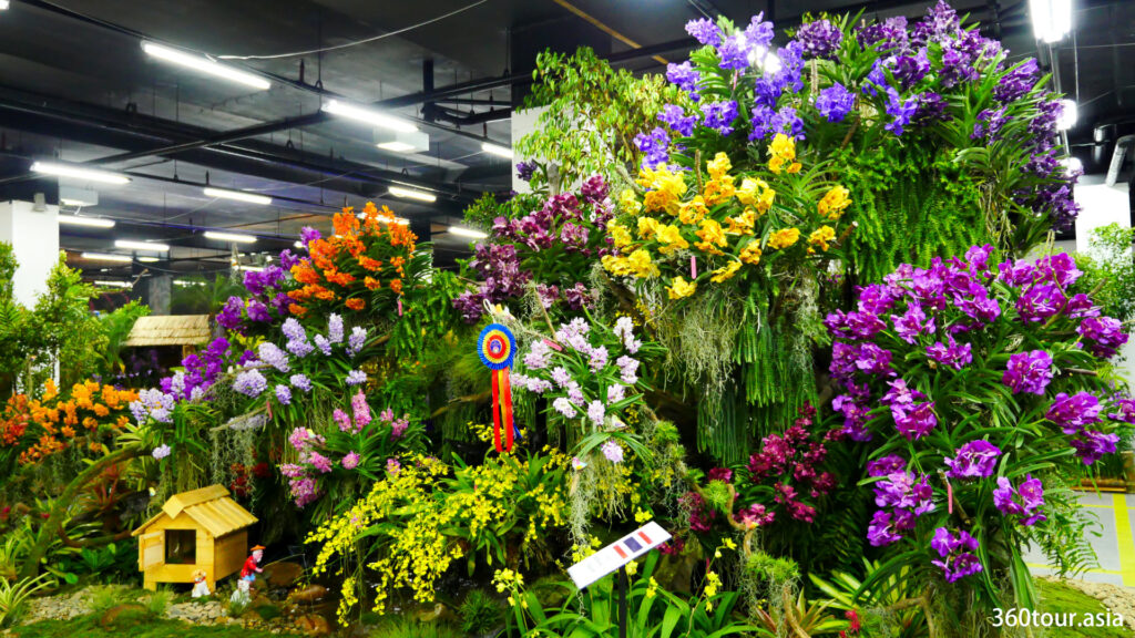 The Orchid Landscape by the Vanda Orchid Society of Thailand, featuring the orchid garden with water feature. 