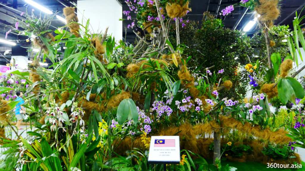 The Orchid Landscape by the Borneo Orchid Society of Sabah, featuring the orchid tree with various stuffed wildlife. 
