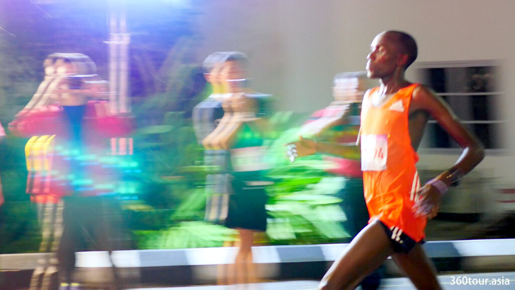 The full marathon runner runs towards the finishing line.