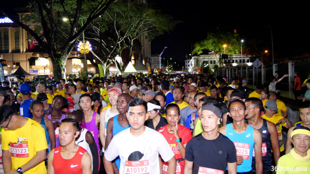 Full marathon runners waiting at the flag off area.