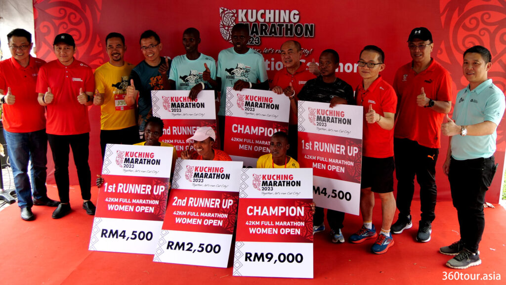 Winners of the Kuching Marathon 2023 open man and women category.