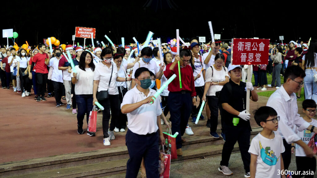 Some of the church members holding LED light sticks during the parade.