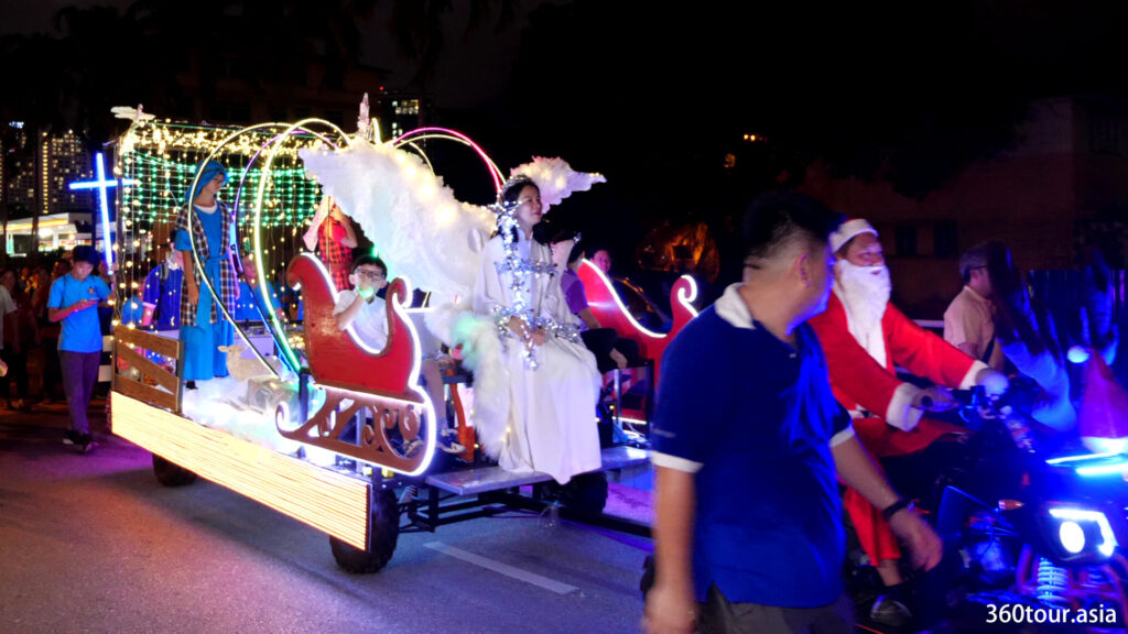 Decorated floats with santa clause and angel sledge.